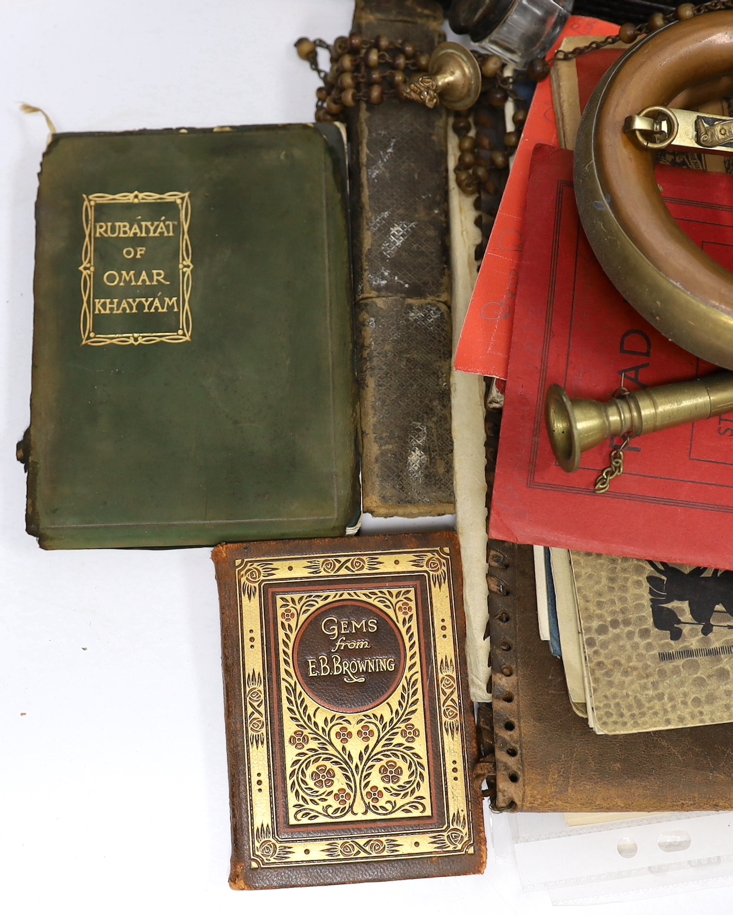 Sundry items including ephemera, empty Victorian photograph albums, bugle, miniature books, rosary and silver lidded glass pot